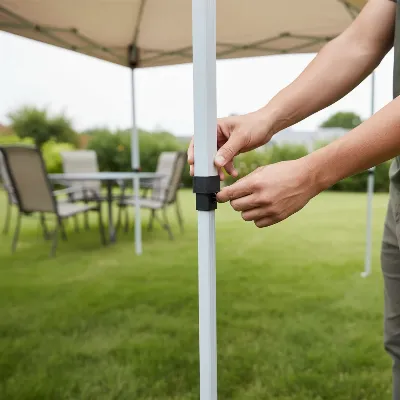 Person adjusting height of pop-up gazebo leg alone, securing it with a locking pin
