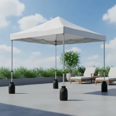 A portable gazebo tent on a concrete patio, secured with elegant black weight bags on each leg, creating a stable outdoor area.