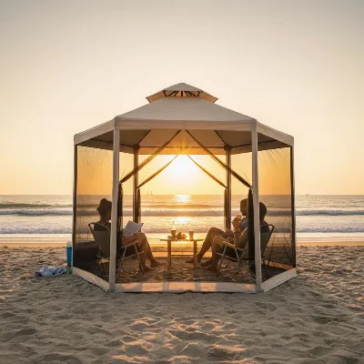 Portable gazebo tent with mosquito net on a sandy beach at sunset, showing people relaxing inside.